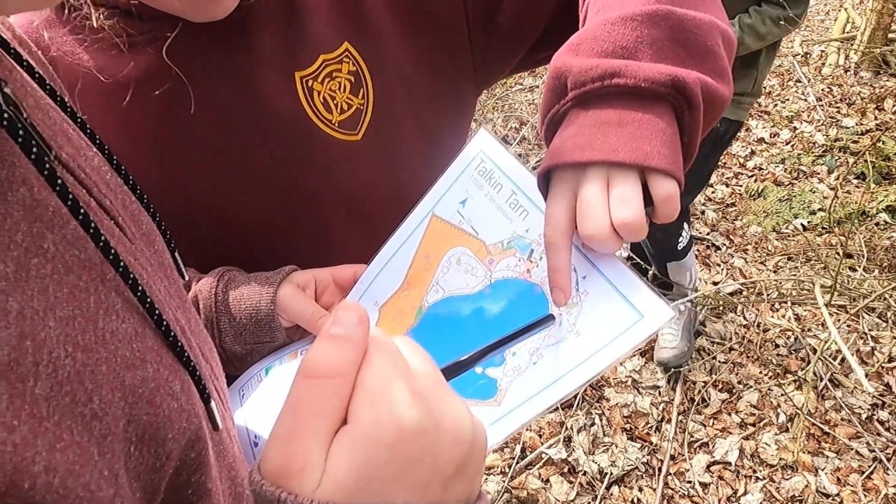 students looking at a map at Talkin Tarn