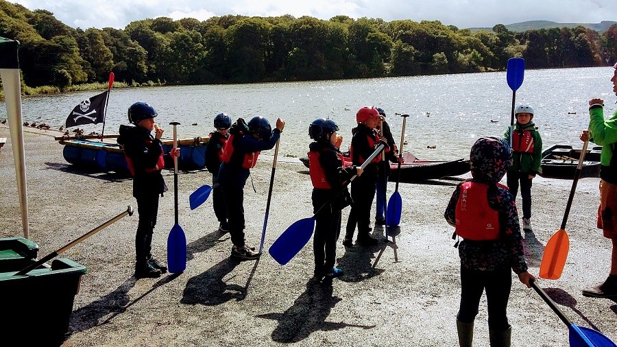 School group learn to paddle on Talkin Tarn near Carlisle
